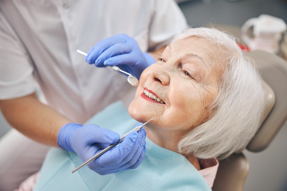 Follow-up dental check-up after implant surgery